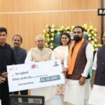 Cricketer Vaibhav Suryavanshi receives a cheque of Rs 50 lakh and a luxury car